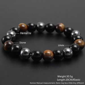 Detail view of 10mm tiger eye beaded bracelet with hematite stone and product dimensions