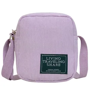 Minimalist light purple corduroy crossbody bag with adjustable strap and front patch