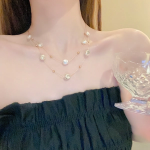 Double-layered stainless steel necklace with baroque pearls and gold chain