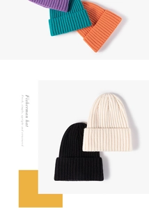 Detailed knit texture of colorful winter beanies in purple, teal, and orange colors