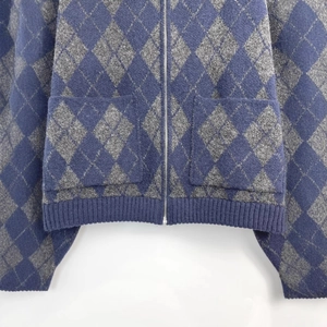 Women's argyle knit bomber jacket in navy and grey with zipper and front pockets