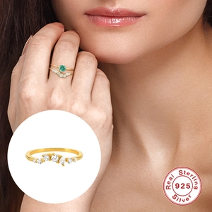 S925 sterling silver ring set with oval green gemstone and V-shaped diamond band