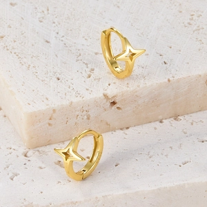 Close-up of gold plated S925 sterling silver hoop earrings with hollow star patterns