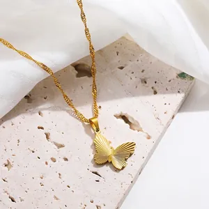 18K gold plated butterfly pendant necklace with textured wings on a wavy chain