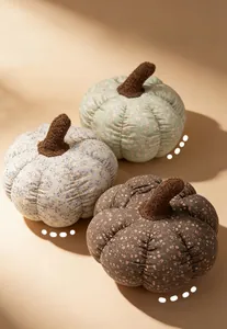 Floral print pumpkin plush pillows in green, blue, and brown for cozy home decor