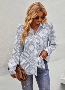 Casual long sleeve shirt with black paisley print styled with jeans and a brown clutch