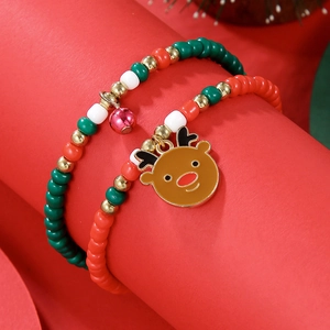 Close-up of Christmas beaded bracelet set with reindeer charm and colorful glass beads
