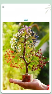 Detailed view of a handmade crystal money tree with colorful stones on a real wood base