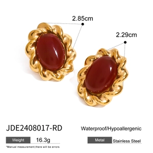 Vintage stainless steel earrings with red agate pendants in a twisted gold-tone frame