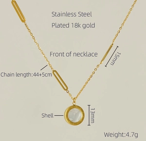 Macro detail of 18K gold-plated stainless steel necklace with shell inlay and Roman numerals