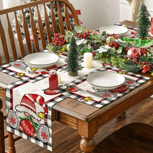 Close-up of Christmas gnome placemat with Believe text and red snowflake patterns