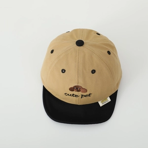 Detailed view of the cute dog embroidery and stitching on the cotton baby baseball cap