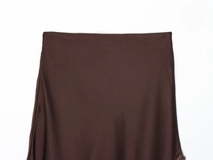 Detail view of smooth dark brown satin skirt waistband with delicate lace trim edging