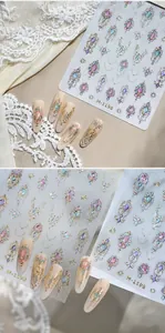 Macro shot of 5D embossed nail stickers with gold moon stars and colorful gems