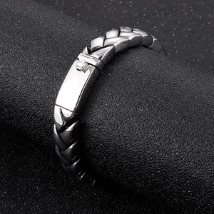 Macro detail of silver wheat chain bracelet showing 11mm keel link texture and clasp