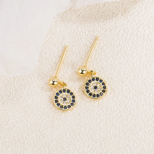 Detailed macro view of S925 silver evil eye stud earrings with blue and white zircons