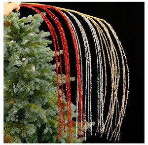 Close-up of sparkling Christmas glitter branches in gold, red and silver colors