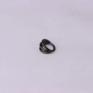 Macro view of a 16G black 316 stainless steel triple-layered hinged clicker ring