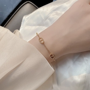 Minimalist S925 sterling silver beaded bracelet with elegant gold finish on female wrist
