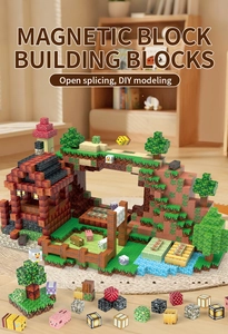DIY magnetic pixel building blocks featuring grass and animal cubes on a cozy carpet