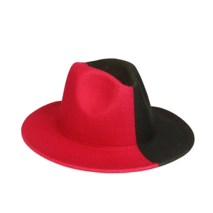 Detailed close-up of a red and black bicolor wool fedora hat with a flat wide brim