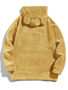Detail of yellow fleece hoodie featuring animal ear accents on the hood for a cozy look