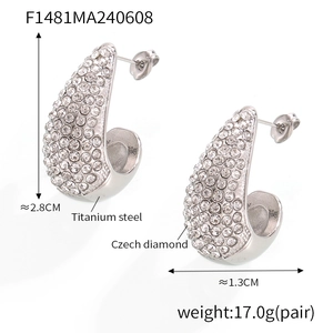Macro shot of silver teardrop earrings in titanium steel with pavé Czech diamonds