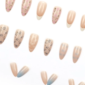 Almond-shaped press-on nails with floral rose patterns and bow designs on white background