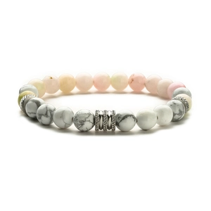 Detail of white turquoise beaded bracelet with marble texture and silver spacer beads