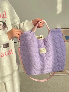 Lavender quilted heart tote bag with rainbow woven handles and adjustable pink strap