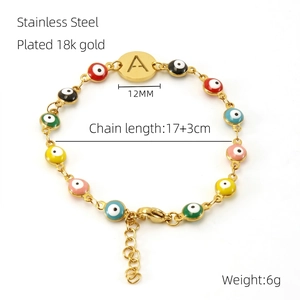 Detail view of 18k gold plated stainless steel bracelet with colorful Evil Eye beads and letter A
