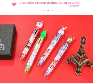 Detail of Christmas multi-color ballpoint pens with Santa and reindeer silicone toppers