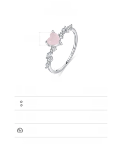 Macro detail of S925 sterling silver ring with pink heart stone and side diamonds