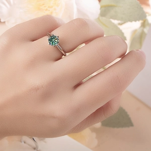 Classic six-prong sterling silver ring featuring a brilliant 1 carat green moissanite stone