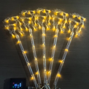 Detail of five LED reindeer garden lights with warm yellow glow and 8-mode controller