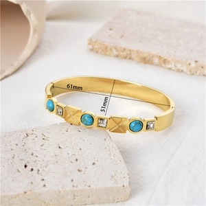 Gold plated stainless steel cuff bracelet with turquoise and zircon stones, 61mm diameter