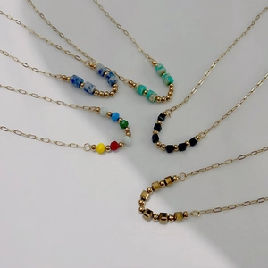French vintage 18k gold plated stainless steel necklaces with colorful beads on white back