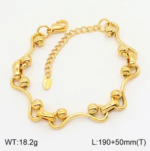 Gold plated stainless steel wave link bracelet with round beads and lobster clasp