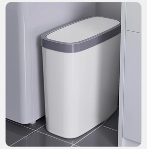 Slim push-top trash can shown in a narrow kitchen gap with a minimalist white and grey finish