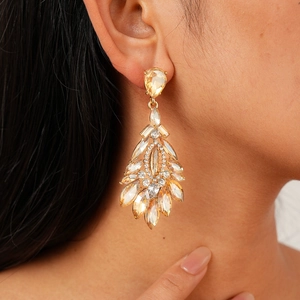 Vintage champagne crystal teardrop earrings with gold plating and ornate hollow design