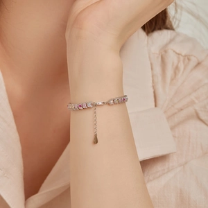 Detail showing S925 silver tennis bracelet with colorful pink, yellow and blue zircons
