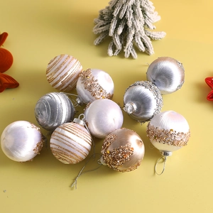 Detailed view of silk-wrapped 6cm Christmas ornaments with glitter and sequins