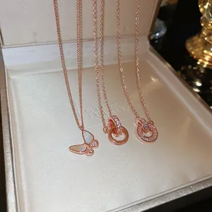 Detail of rose gold butterfly pendant with mother of pearl and shimmering zircons