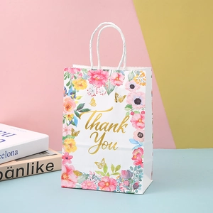 White kraft paper gift bag with floral prints and gold Thank You foil lettering