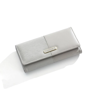 Detail of grey paneled long wallet for women with gold metal plate and wave texture