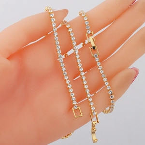 Elegant gold plated tennis bracelet with round clear cubic zirconia stones on hand