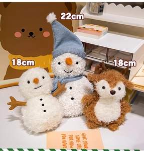 Detail showing 18cm snowman and 22cm reindeer plush toys with fluffy texture