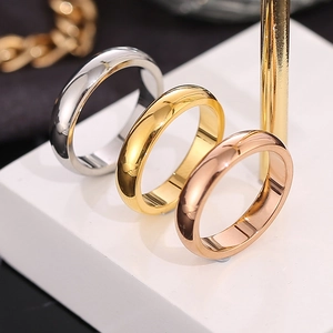 Set of three minimalist titanium steel rings in silver, gold, and rose gold finishes