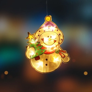 Hanging snowman LED Christmas light decoration with warm yellow glow and tree accessory