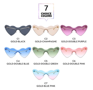 Flat lay of rimless heart-shaped sunglasses in seven vibrant colors with metal temples